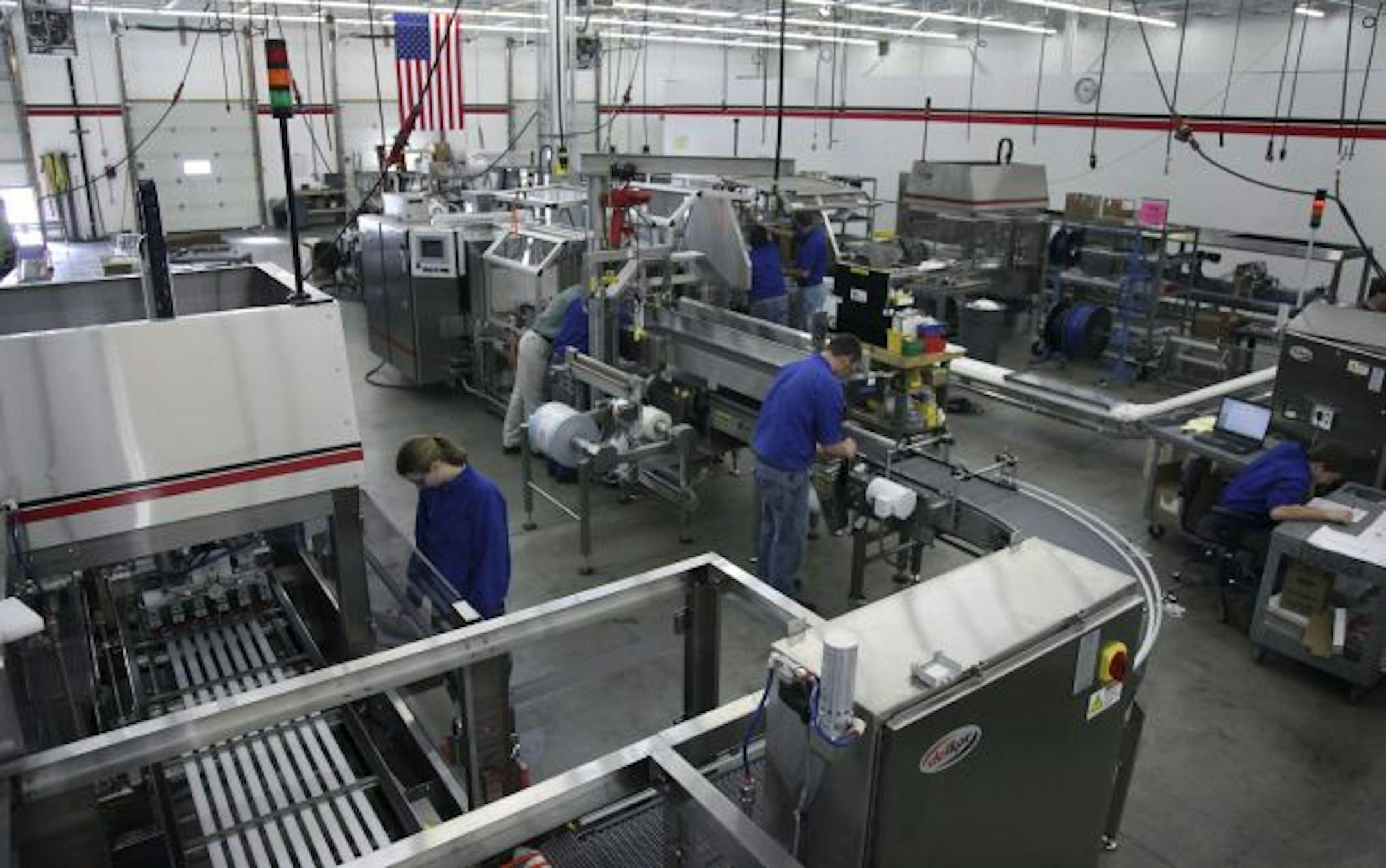 Delkor Systems service technicians tested different packaging machines at their Circle Pines plant.