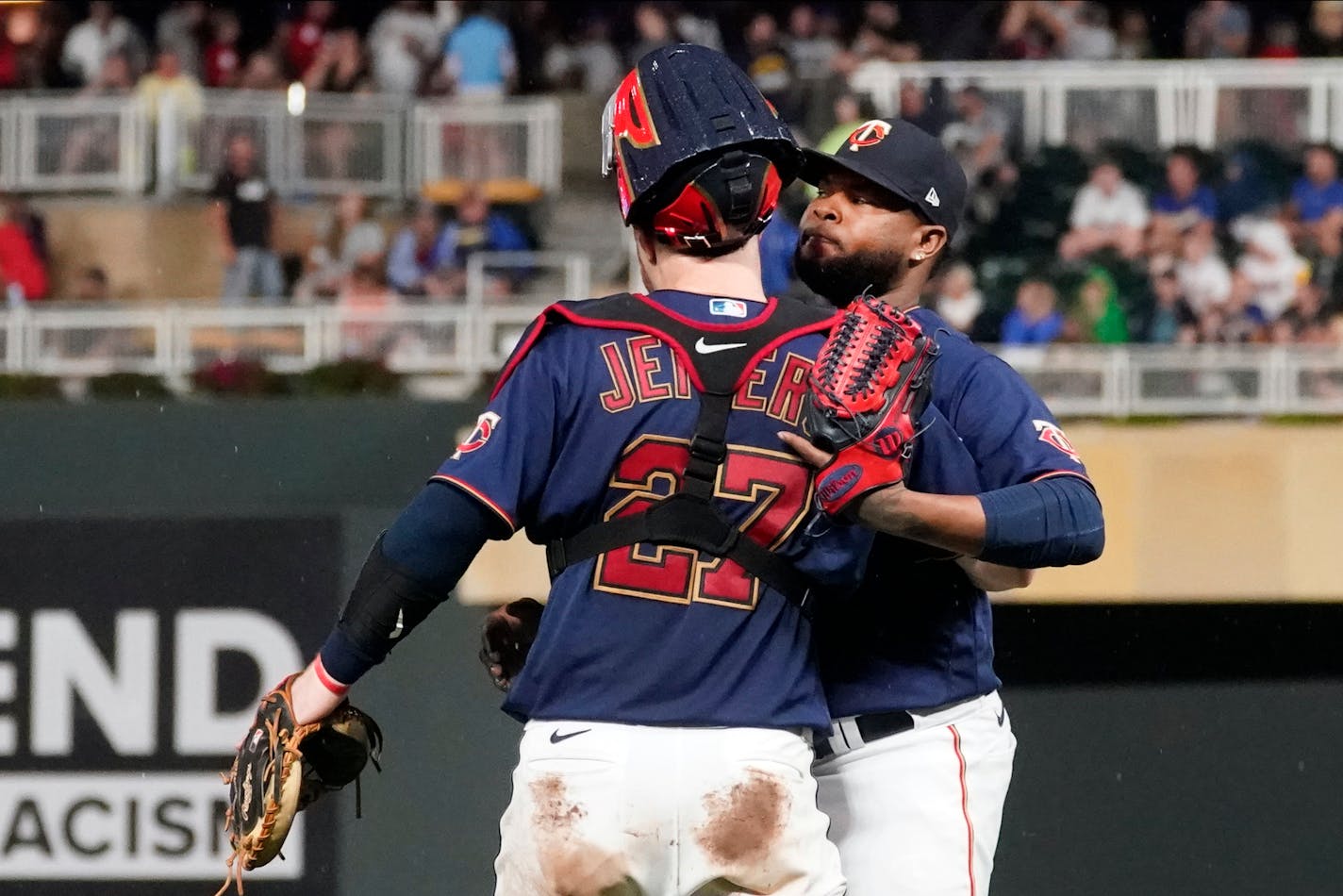 Minnesota Twins catcher Ryan Jeffers (27) and pitcher Alex Colome celebrate after they defeated the Milwaukee Brewers in a baseball game Saturday, Aug. 28, 2021, in Minneapolis. (AP Photo/Jim Mone)