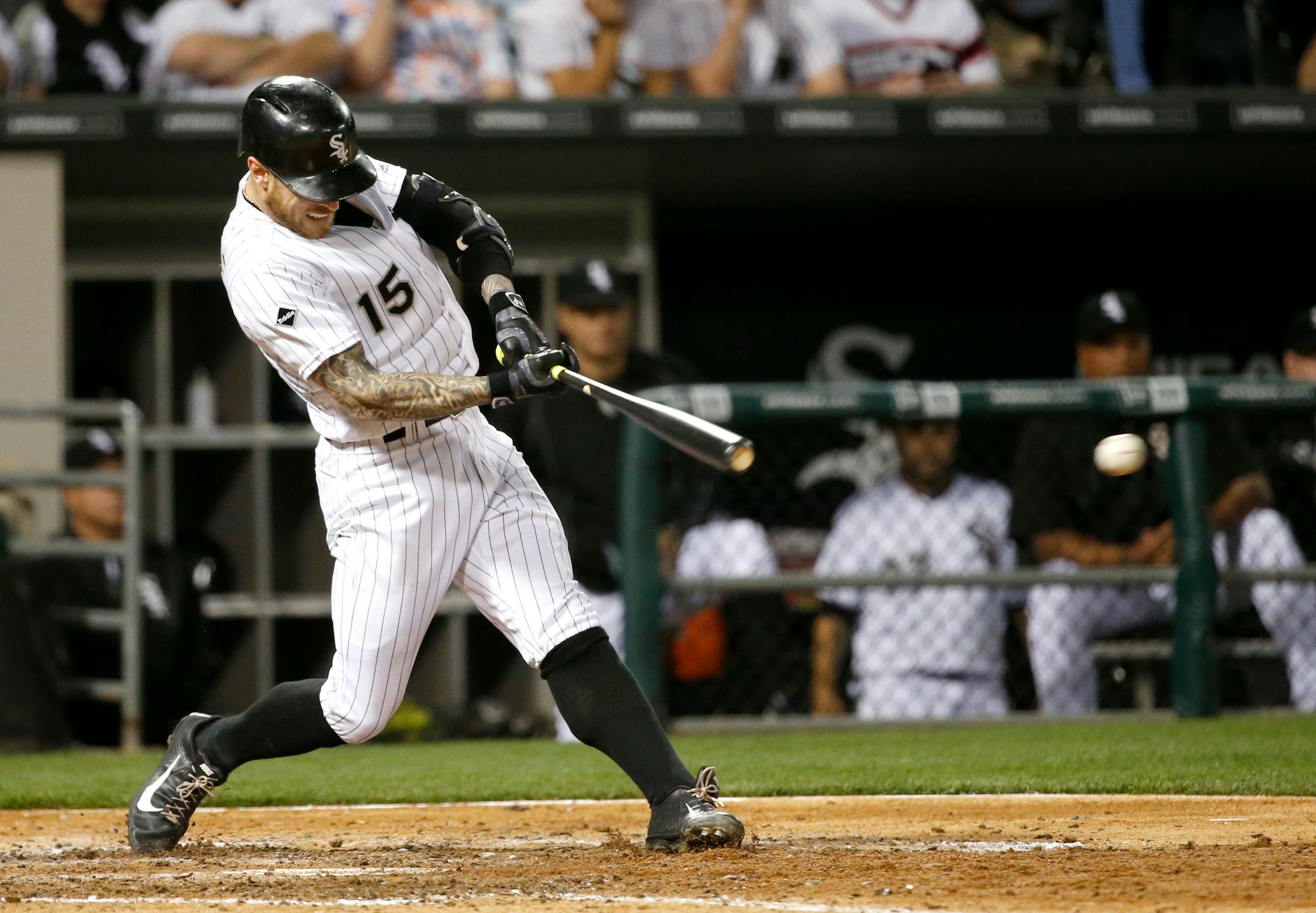 Chicago White Sox's Brett Lawrie hits an RBI-single off Minnesota Twins starting pitcher Ricky Nolasco, scoring Todd Frazier, during the fifth inning of a baseball game Friday, May 6, 2016, in Chicago. (AP Photo/Charles Rex Arbogast)