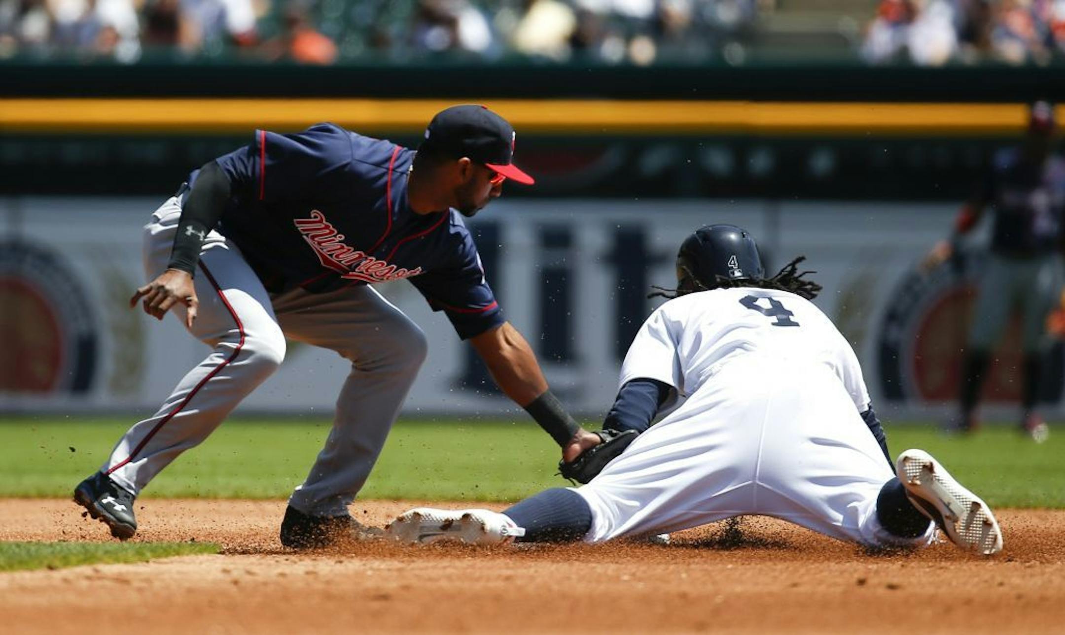 Detroit Tigers' Cameron Maybin steals second base as Minnesota Twins shortstop Eduardo Nunez applies a late tag in the second inning of a baseball game in Detroit, Wednesday, May 18, 2016.