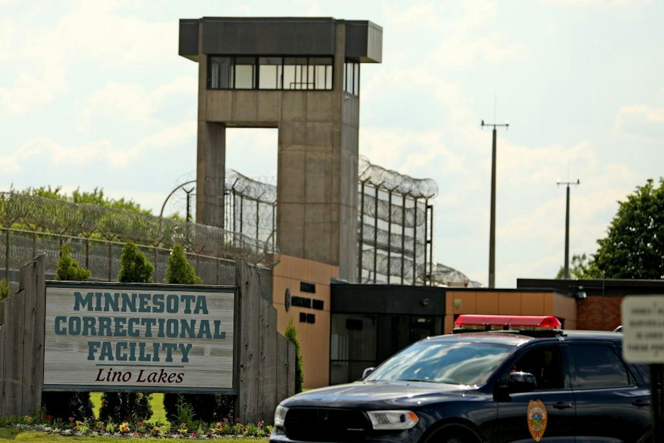 Correctional officers patrolled the grounds after an inmate hijacked a transport van full of prisoners from the Minnesota Correctional Facility in Lino Lakes, Minn.