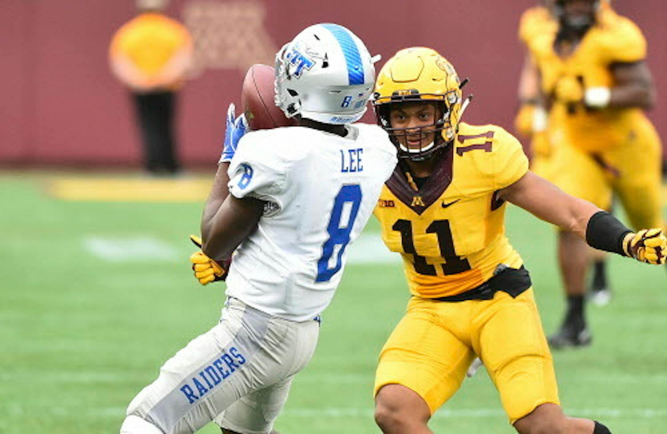 Middle Tennessee wide receiver Ty Lee catches a pass against Minnesota defensive back Antoine Winfield Jr. in the second half of an NCAA college football game Saturday, Sept. 16, 2017, in Minneapolis. (AP Photo/John Autey)