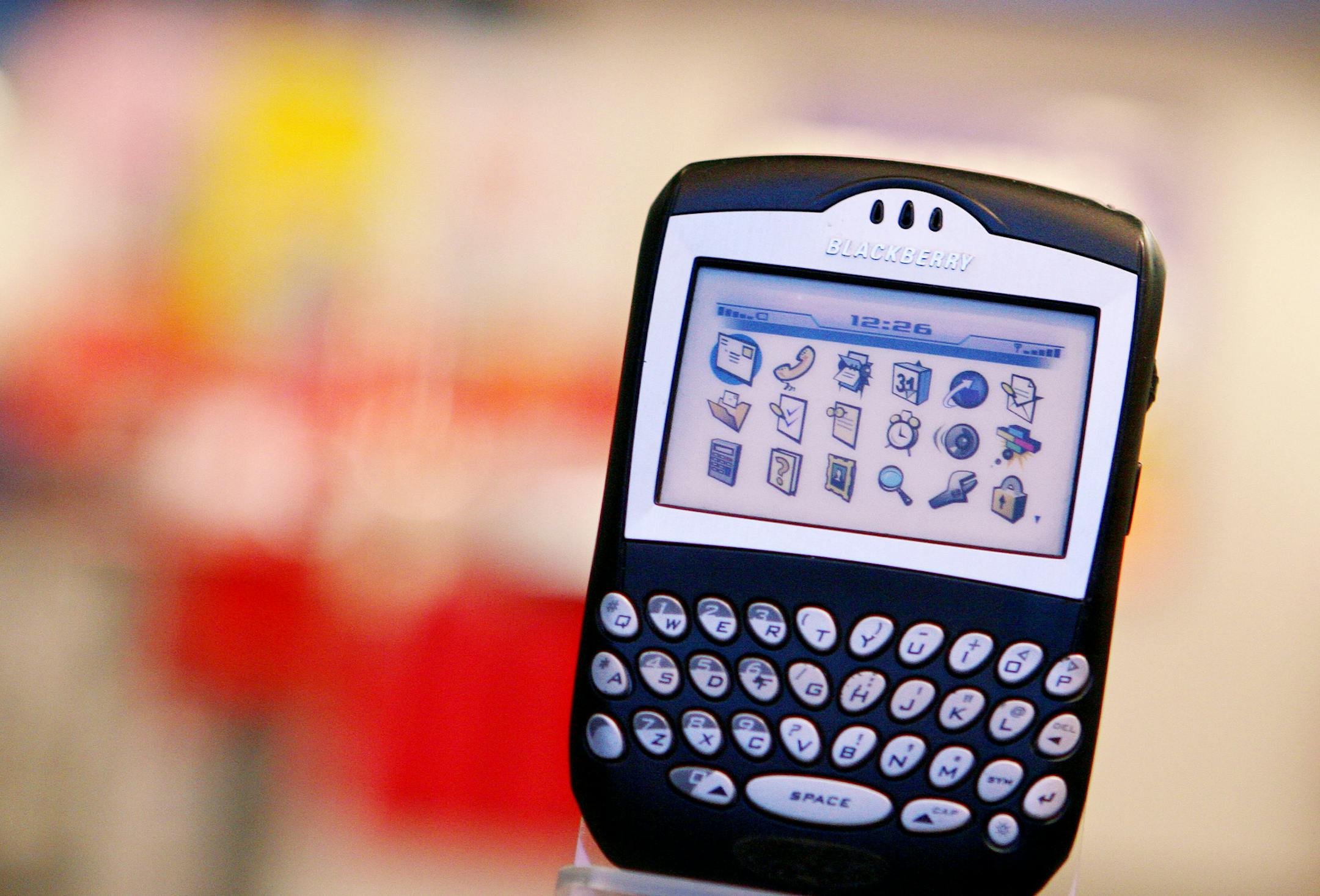 FILE- In this Tuesday, May 2, 2006 file photo, a Blackberry device is on display in New York. Back in 2006 when the U.S. Federal Reserve last raised interest rates before its rate-hike decision Wednesday, Dec. 16, 2015, Blackberry phones were riding high particularly in the world of business. Apple's subsequent launch of the iPhone is widely blamed for Blackberry's fall from grace. Now Blackberry has minimal market share and recently launched its latest attempt at a comeback. (AP Photo/Mark Lenn