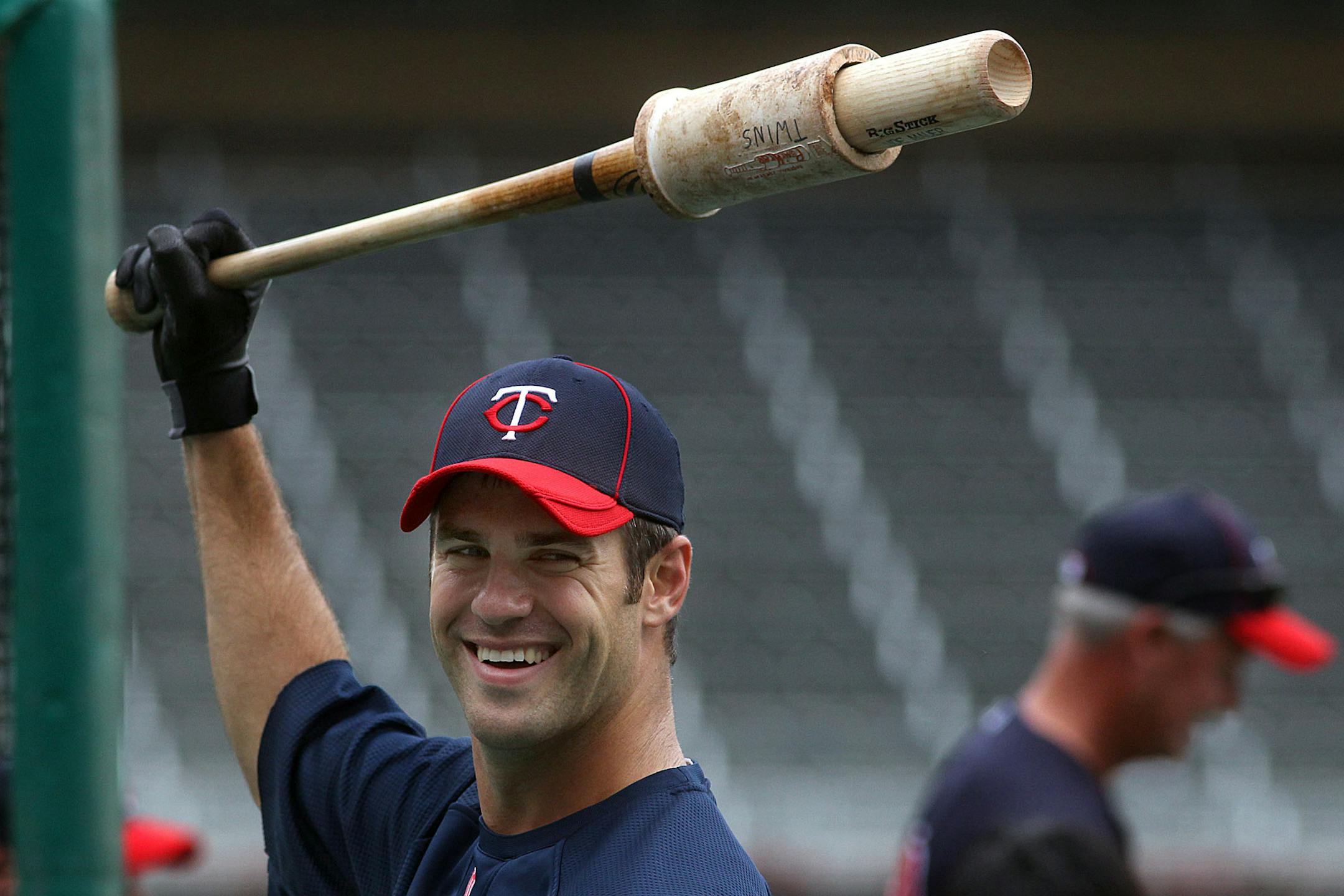 Minnesota Twins' Joe Mauer loosens up during batting practice before a baseball game against the San Diego Padres Friday, June 17, 2011 in Minneapolis. (AP Photo/The Star Tribune, Jim Gehrz) MANDATORY CREDIT; ST. PAUL PIONEER PRESS OUT; MAGS OUT; TWIN CITIES TV OUT ORG XMIT: MIN2013040920070502