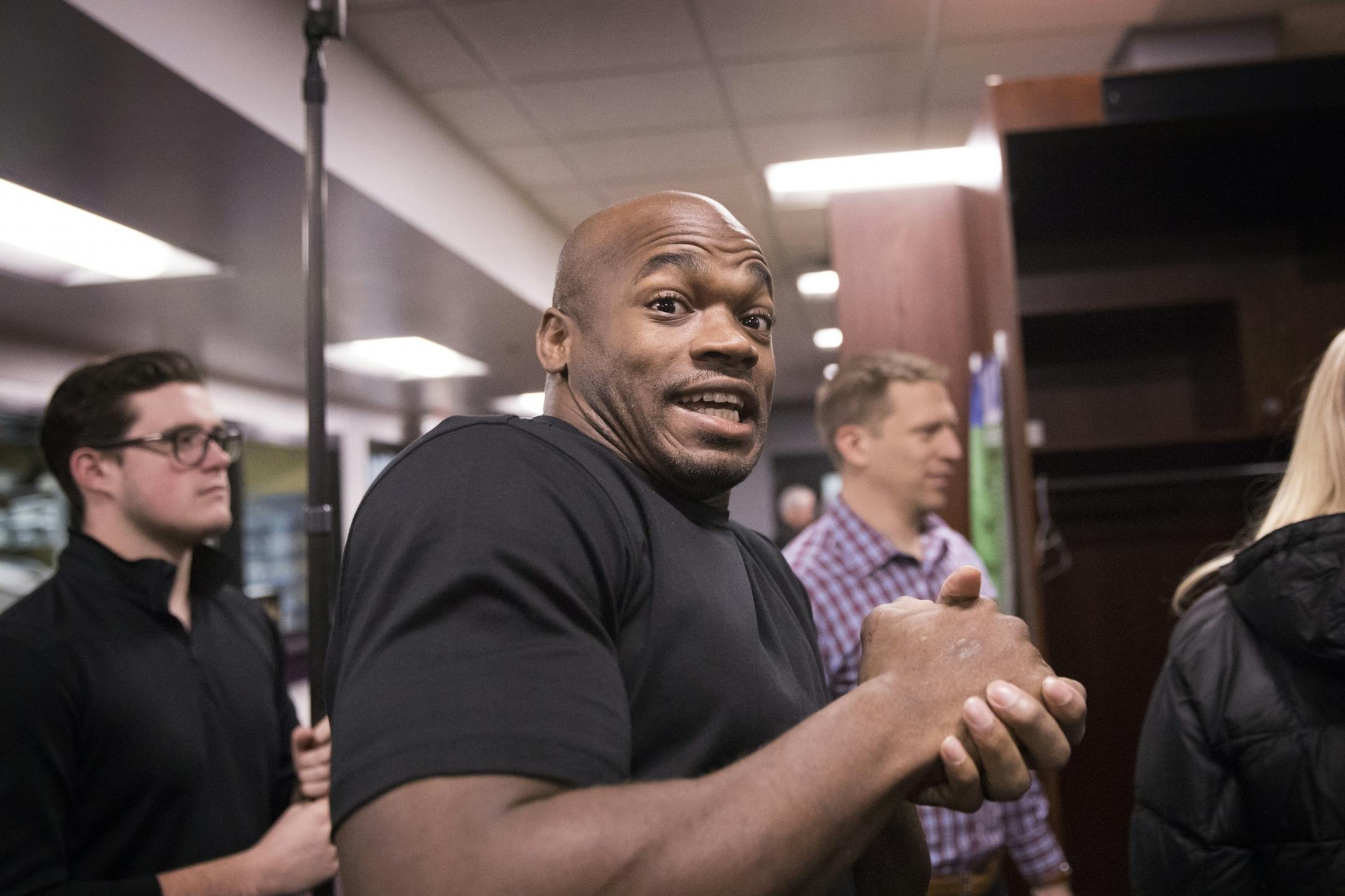 Adrian Peterson reacts playfully to the camera.