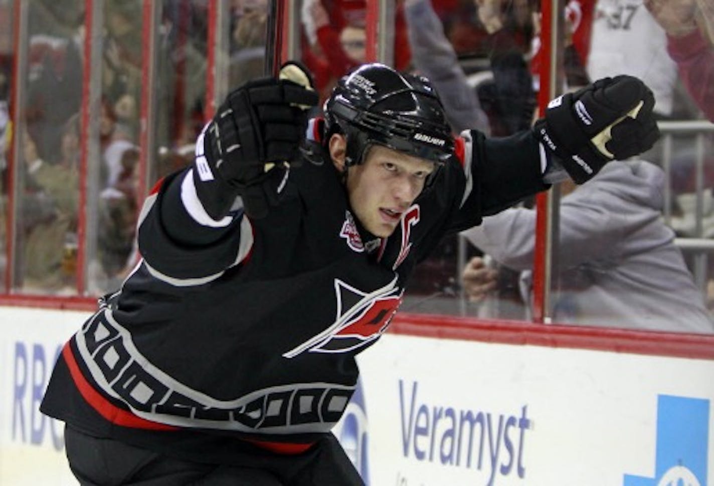 Carolina Hurricanes' Eric Staal (12) celebrates his hat trick goal against the Anaheim Ducks during the second period of an NHL hockey game, Saturday, Dec. 18, 2010, in Raleigh, N.C.