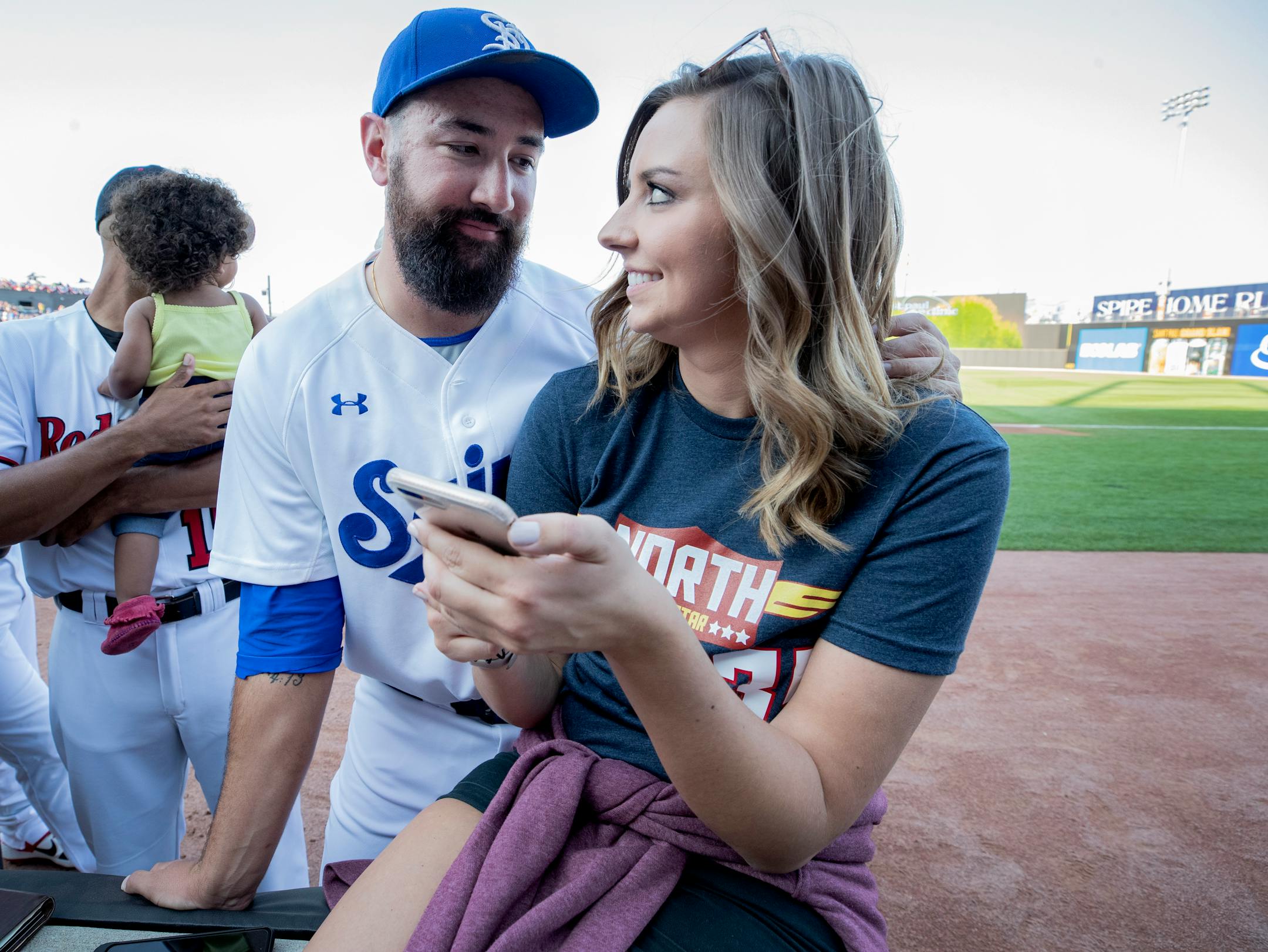 St. Paul Saints pitcher Todd Van Steensel talked to his girlfriend Natalie Misk before the start if the American Association All-Star Game.