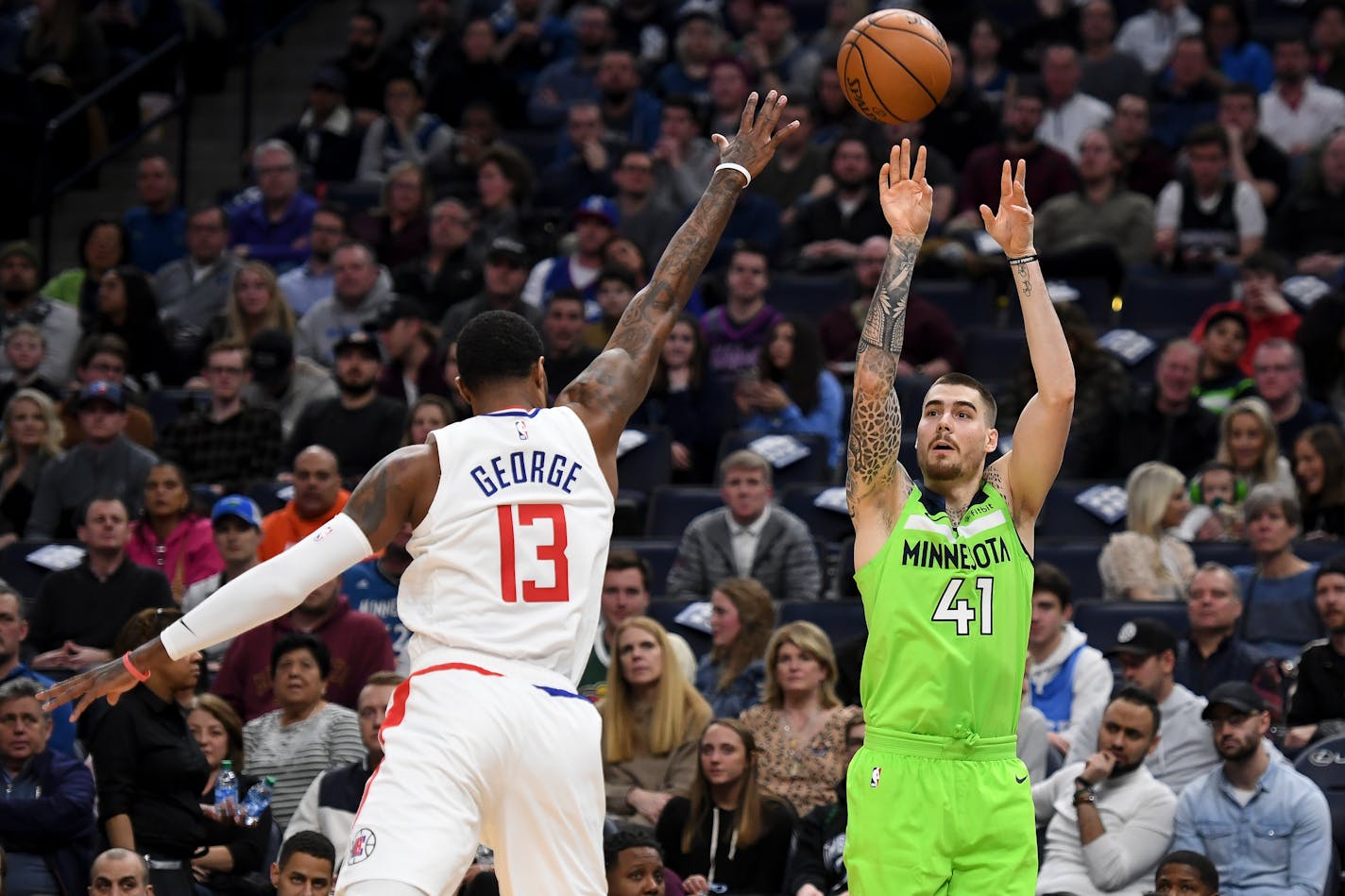 Timberwolves forward Juan Hernangomez hit a 3-pointer as he was defended by LA Clippers guard Paul George