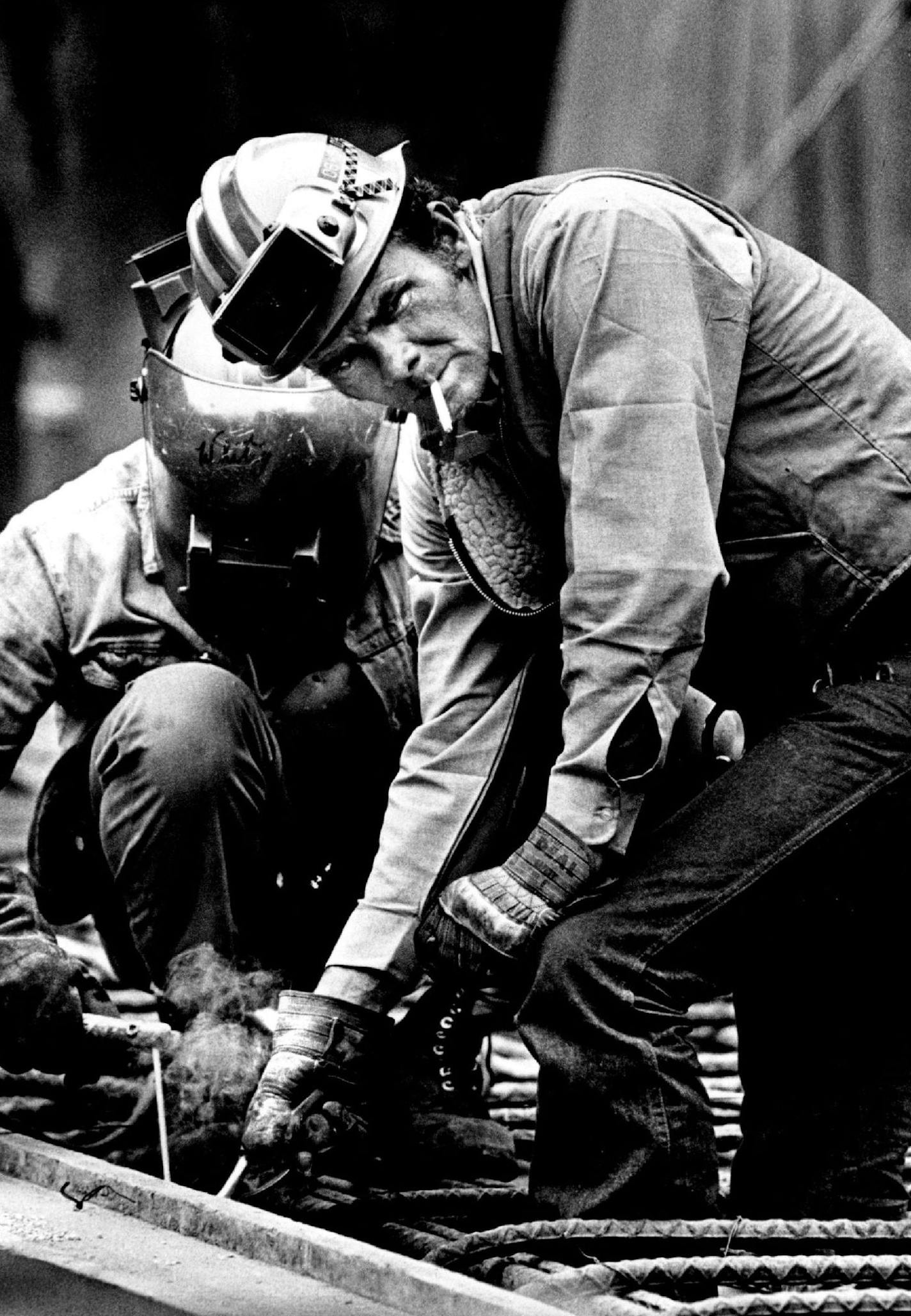 May 20, 1978 Dick Cassidy looked away as Paul Davis welded a Iron rod. The two are Iron workers for Kaiser. New construction at existing reserve plant. Bruce Bisping, Minneapolis Star Tribune ORG XMIT: MERc829ca2ce4b0fa0c96a9c904d31a7