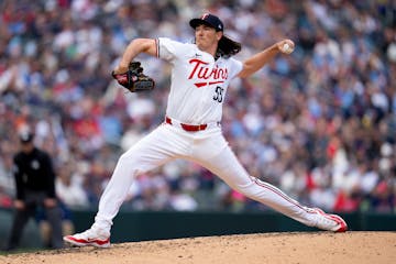 Twins relief pitcher Kody Funderburk (55) throws out a pitch in the sixth inning of the Twins home opener.