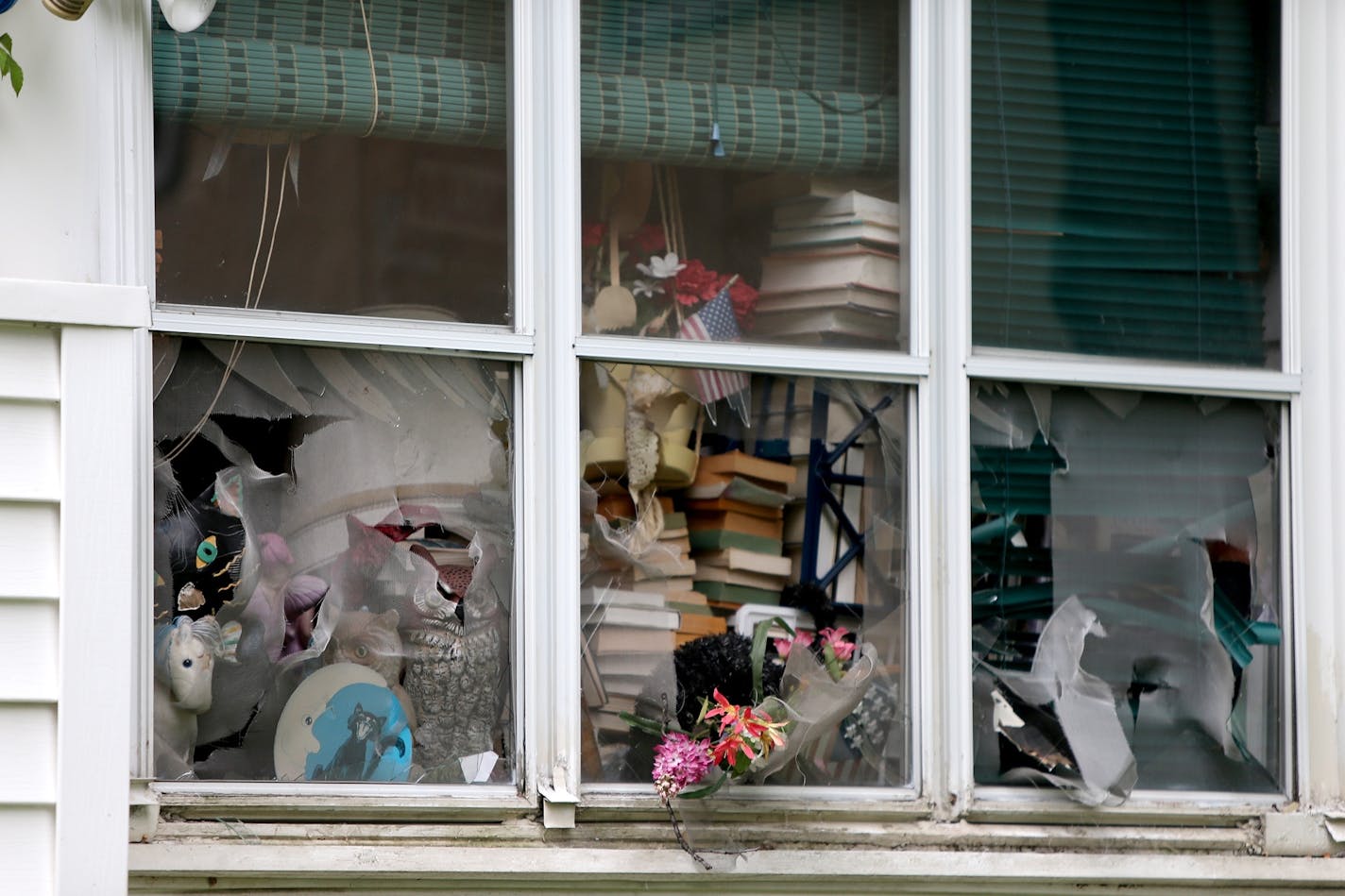 Evidence of the hoarding at a the scene of a fatal house fire on Hamline Avenue North in St. Paul on Tuesday.