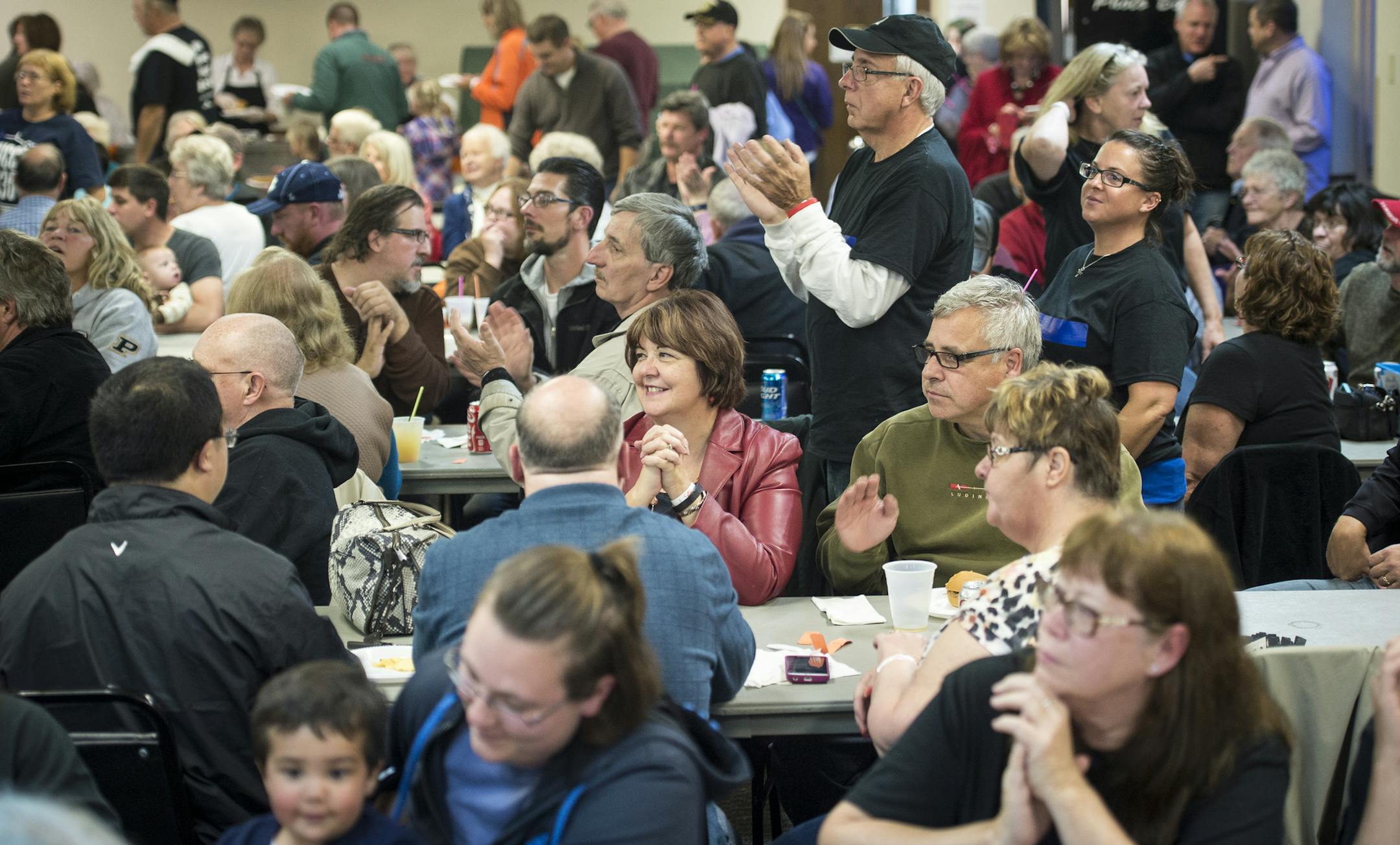 Some of the few hundred attendees at Friday night’s pro-police rally in Coon Rapids applauded Anoka County Sheriff James Stuart as he addressed the crowd.