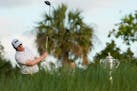 Derek Holmes watches his tee shot on the first hole during the first round of the PGA Championship golf tournament on the Ocean Course Thursday, May 2