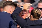Republican presidential candidate former President Donald Trump is helped off the stage by U.S. Secret Service agents at a campaign event in Butler, P