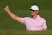 Rory McIlroy celebrates after an eagle on the 15th hole from the bunker during the final round of the Wells Fargo Championship in Charlotte, N.C., on 