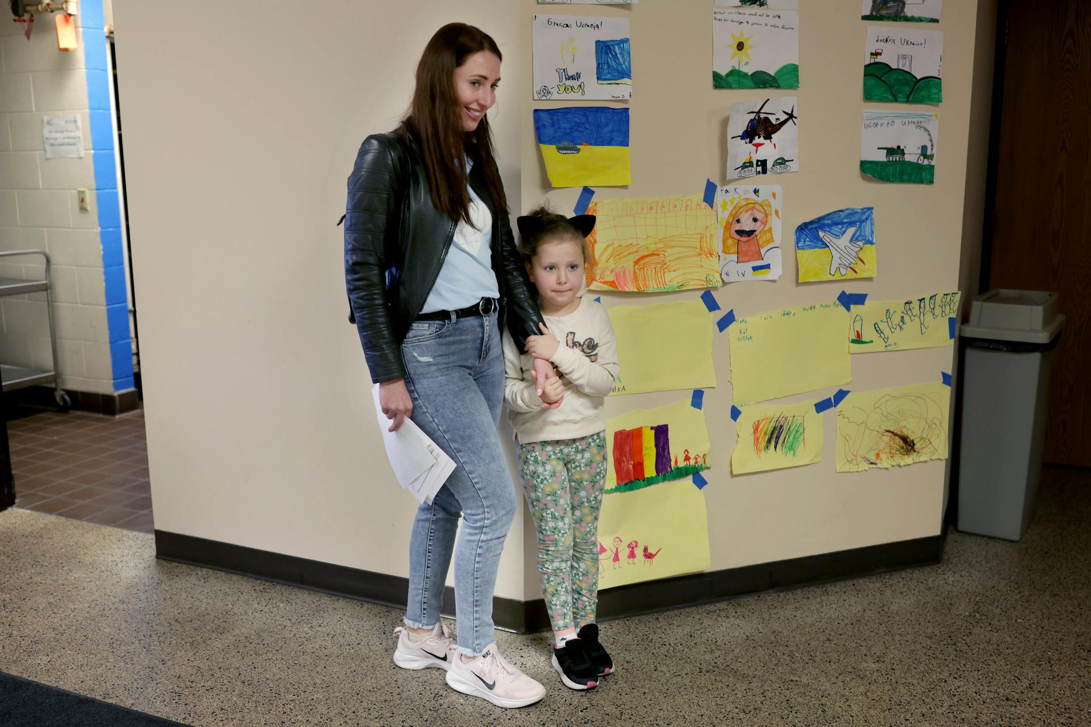 Ukrainian refugee Natalia Kuchma, attempts to coax her daughter Solomiia Kuchma, 5, to join other dancers during a dance class at the Ukrainian American Community Center.