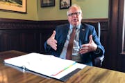 Gov. Tim Walz on Tuesday said he is "certainly willing to look at" legislation that would allow college athletes in Minnesota to hire agents and make 