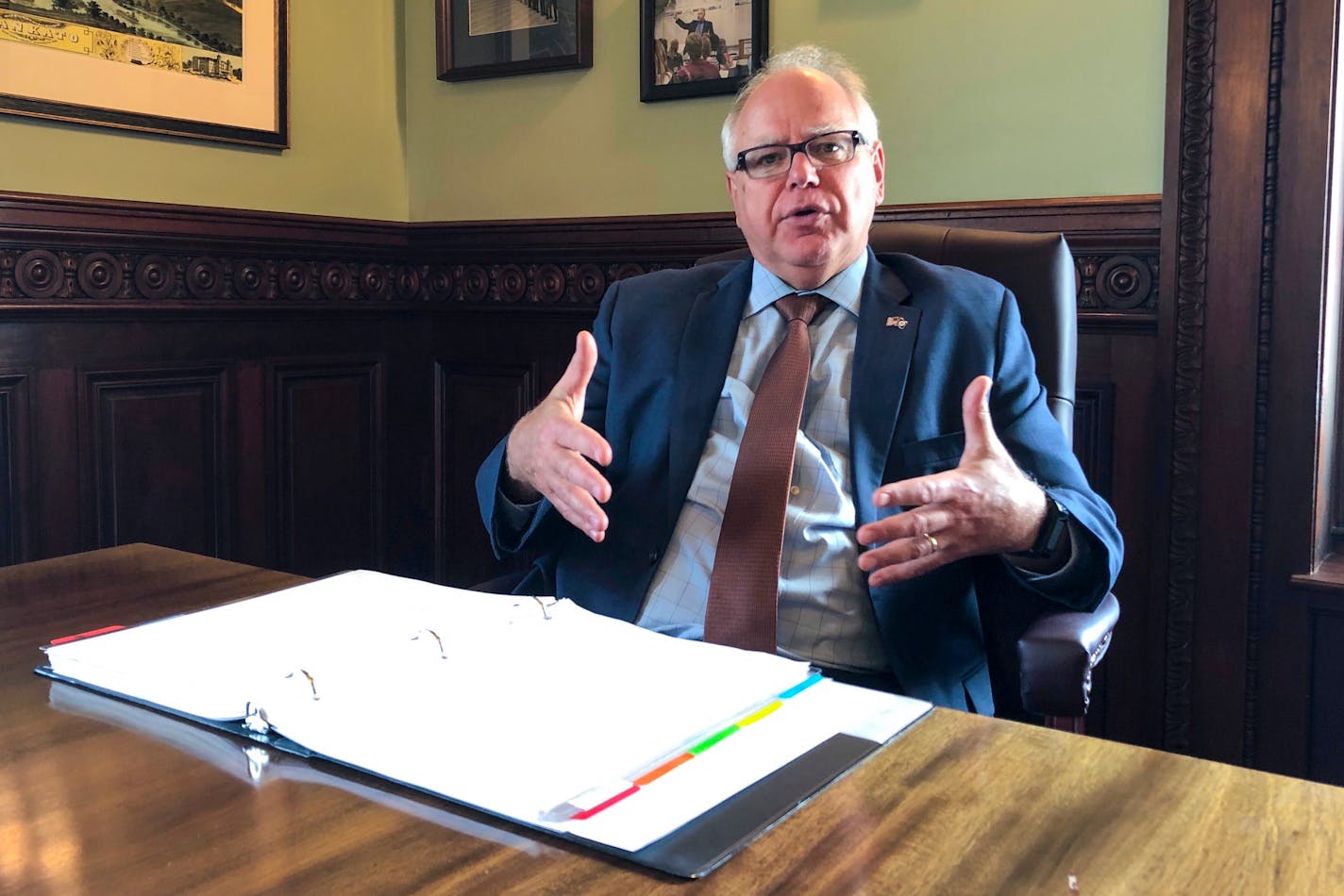 Gov. Tim Walz on Tuesday said he is "certainly willing to look at" legislation that would allow college athletes in Minnesota to hire agents and make money off endorsements, just as a newly signed law in California would.