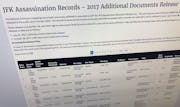 Part of a web page showing the page from the National Archives showing a listing of records released on Thursday, Oct. 26, 2017, in Washington, relati