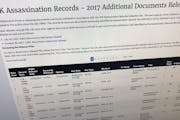 Part of a web page showing the page from the National Archives showing a listing of records released on Thursday, Oct. 26, 2017, in Washington, relati