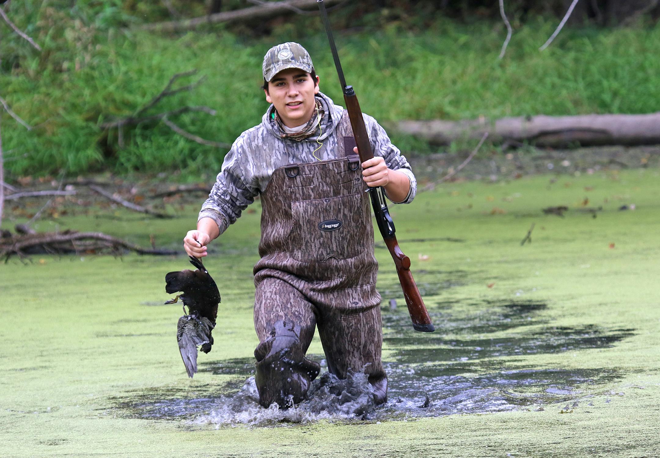 Tanner Montez, 16, a junior at Park High School in Cottage Grove, retrieves a wood duck he shot on opening day of the Minnesota duck season. He the youngest of four brothers who hunt together every weekend of the season. Their father, Troy, infected them with a passion for the sport and he still joins them for most of the outings.They all live under the same roof.