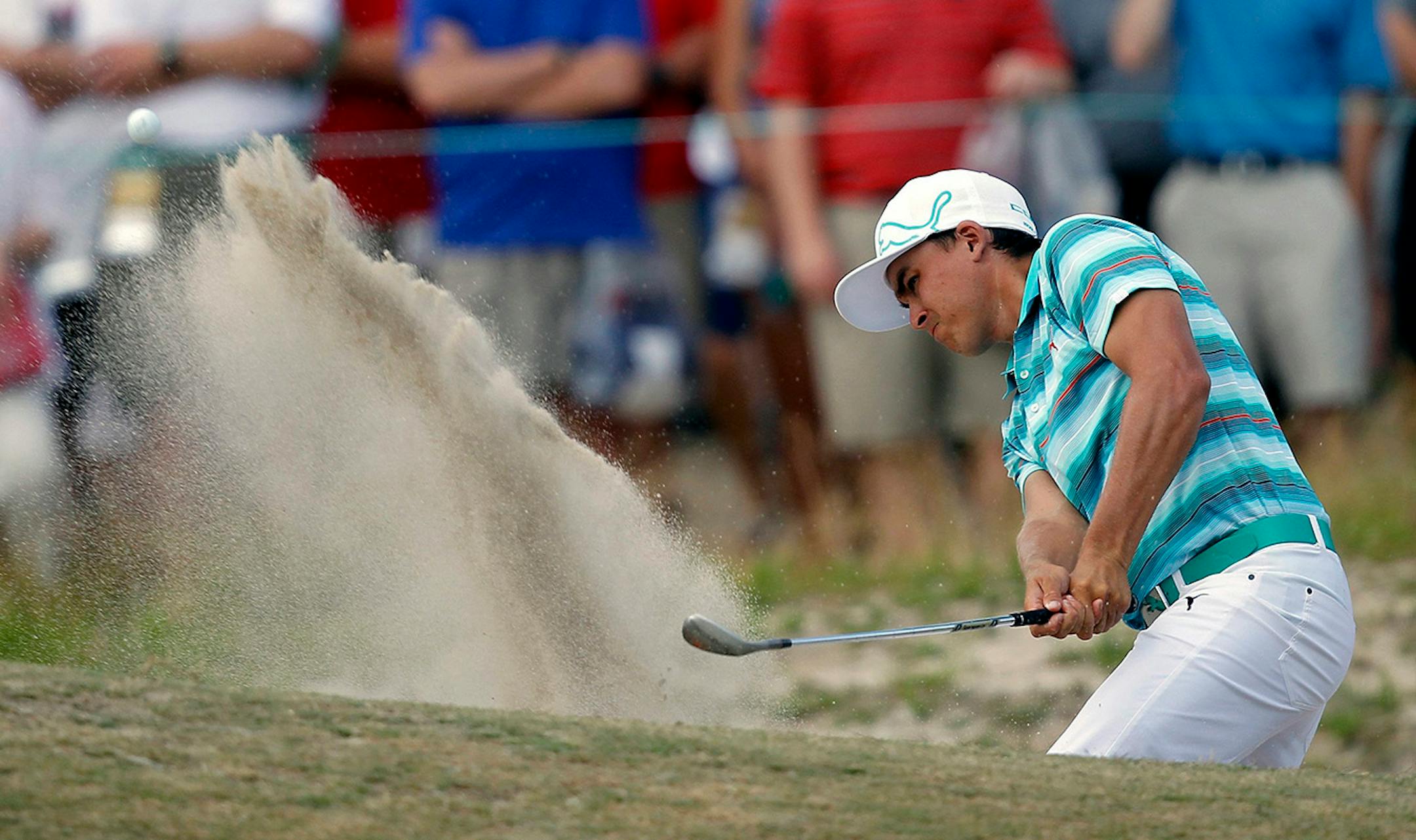 Ricky Fowler hits out of a trap on the 11th hole during the third round of the 2014 U.S. Open at Pinehurst No. 2 in Pinehurst, N.C., Saturday, June 14, 2014.