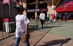 Fans leave Angel Stadium when a baseball game between the Minnesota Twins and the Los Angeles Angels was postponed Saturday, April 17, 2021, in Anahei