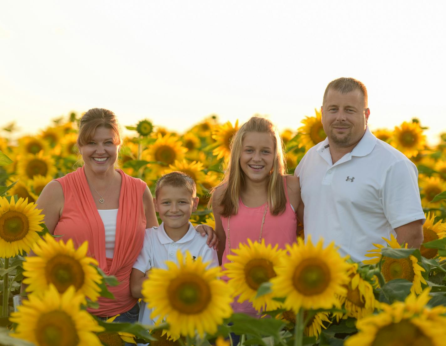 On the family pictures the names are Jenni, Mitchell Smude (our son), Katelyn Smude (our daughter), and Tom Smude in the sunflowers. Credit: Smude Photography