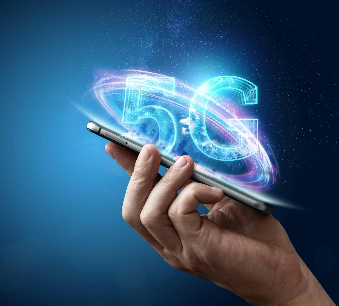 Creative background, male hand holding a phone with a 5G hologram on the background of the city. The concept of 5G network, high-speed mobile Internet, new generation networks. Copy space, Mixed media.