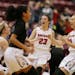 Mustangs Macy Smith (23) celebrated with teammates there 67-65 overtime win over Ada-Borup during quarter finals Class 1A girls action at Mariucci Are