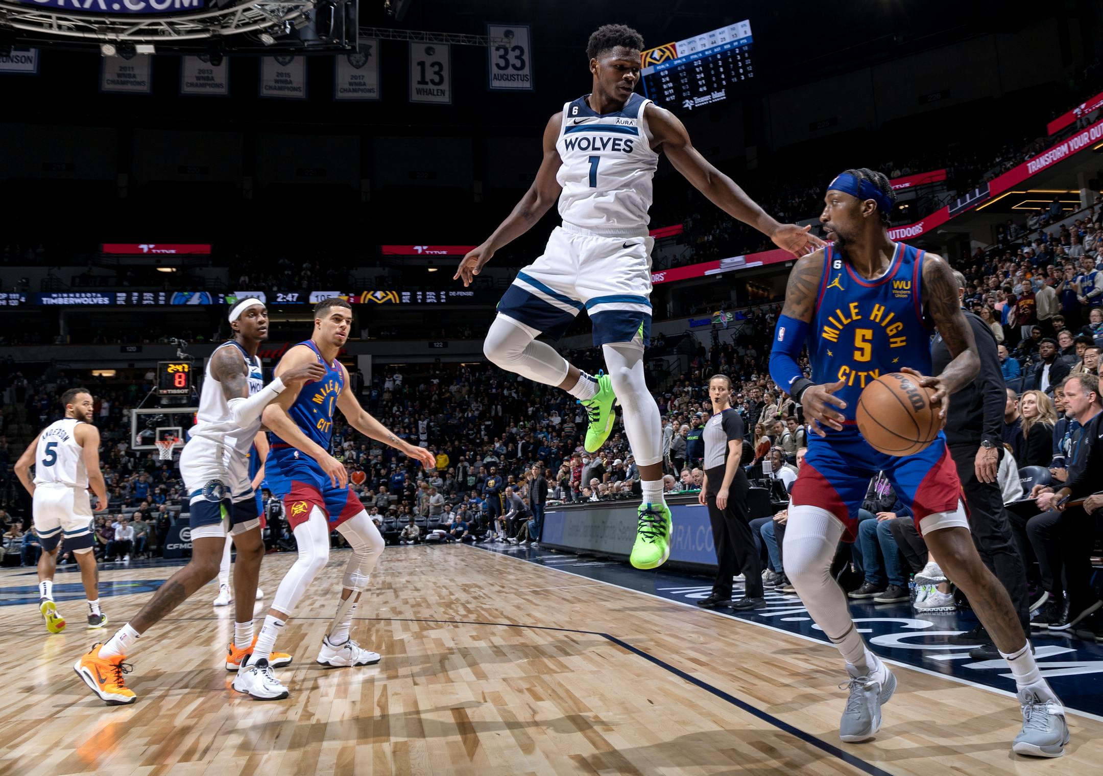 Anthony Edwards (1) of the Minnesota Timberwolves defends Kentavious Caldwell-Pope (5) of the Denver Nuggets in the fourth quarter.