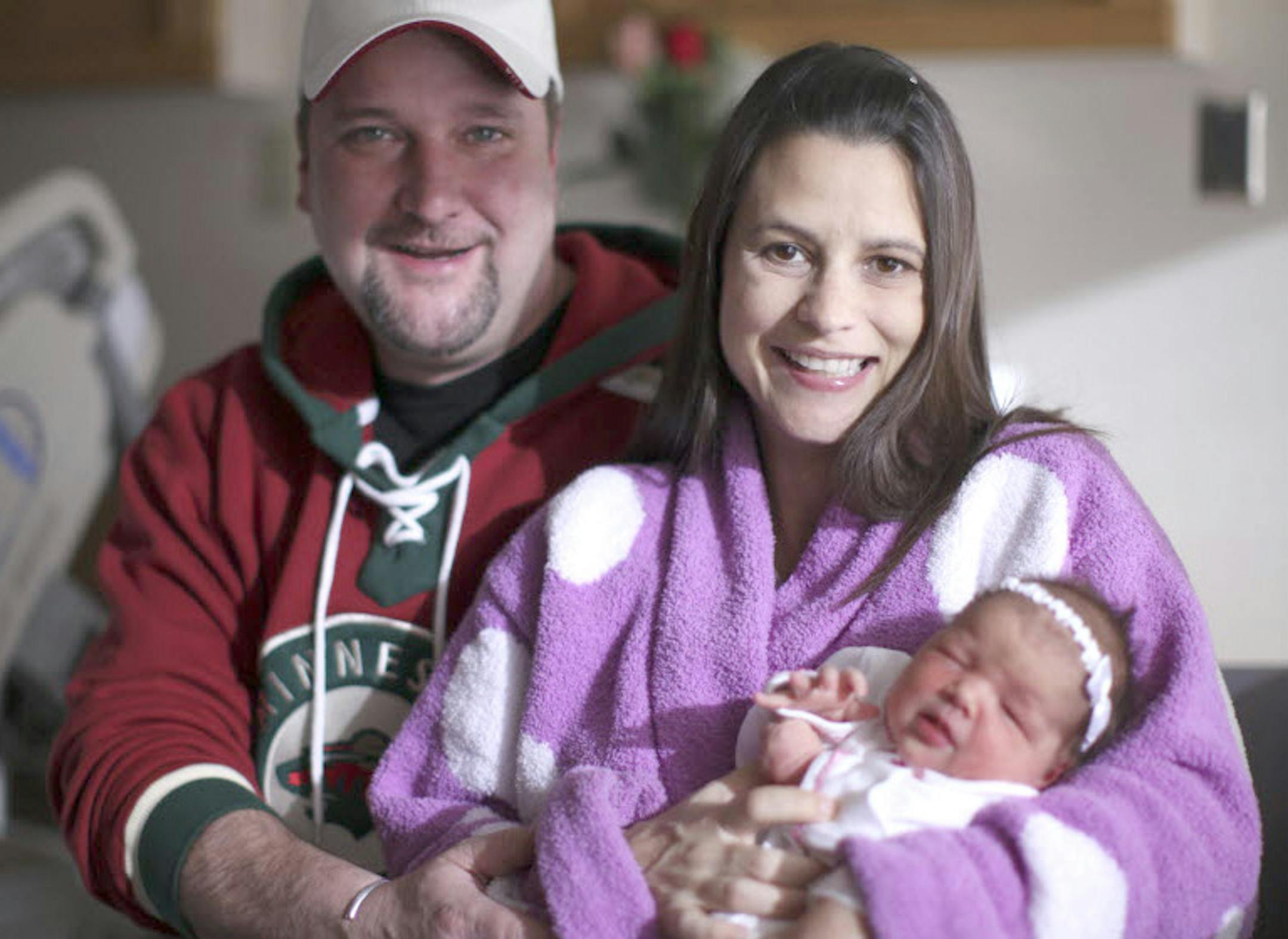 Jim Huber and Jill Macioch with their daughter, Jordyn Huber, at St. John's Hospital in Maplewood.