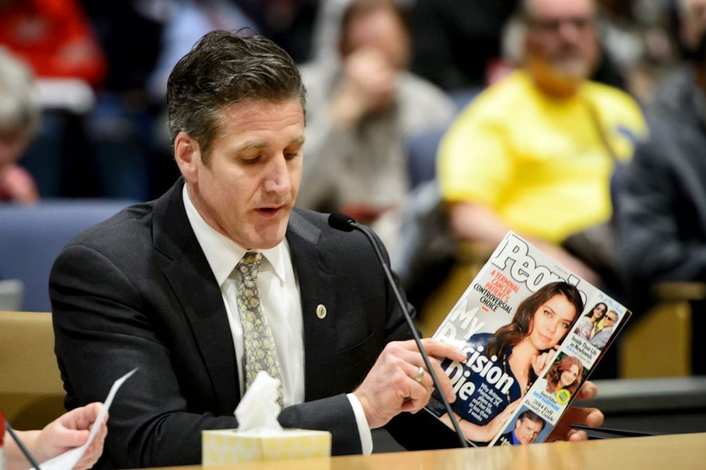 Dan Diaz, holding a magazine cover featuring his wife Brittany Maynard, testified before a Minnesota Senate panel in support of the Compassionate Care Act on Wednesday, March 16. Maynard died using Oregon's Death with Dignity Act but the couple had to move from California to Oregon to take advantage of the law.