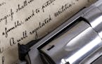 close up of the bill of rights with a revolver