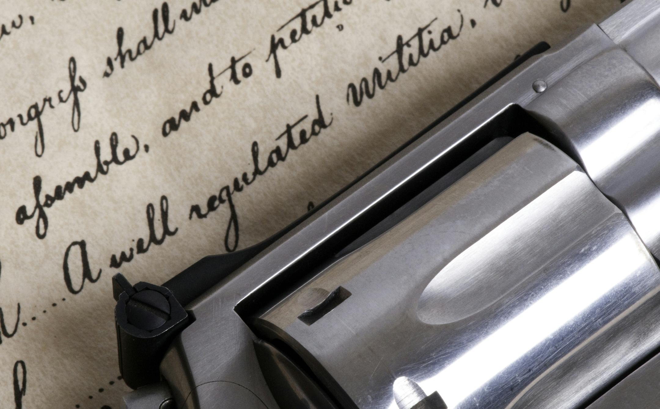 close up of the bill of rights with a revolver