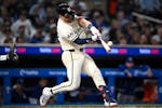 Twins catcher Ryan Jeffers (27) hits a solo home run against the Dodgers on April 9. Jeffers has nine home runs this season; eight have come when he h