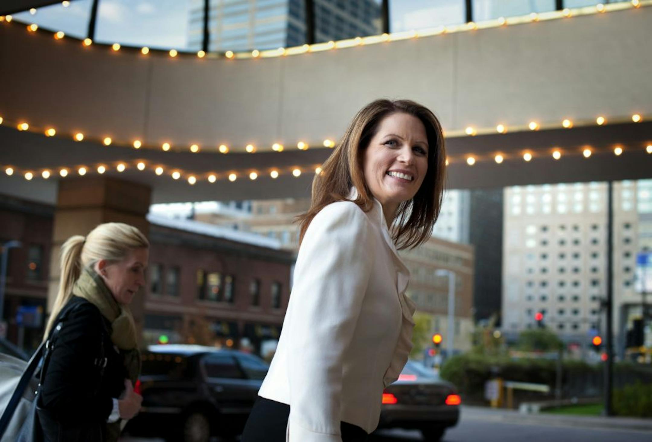 Presidential hopefull Michele Bachmann arrived at the Minneapolis Hilton, Thursday, October 27, 2011for a fundraiser dinner and reception. Earlier her campaign cancelled the scheduled town hall meeting. Behind her is campaign communications director Alice Stewart.