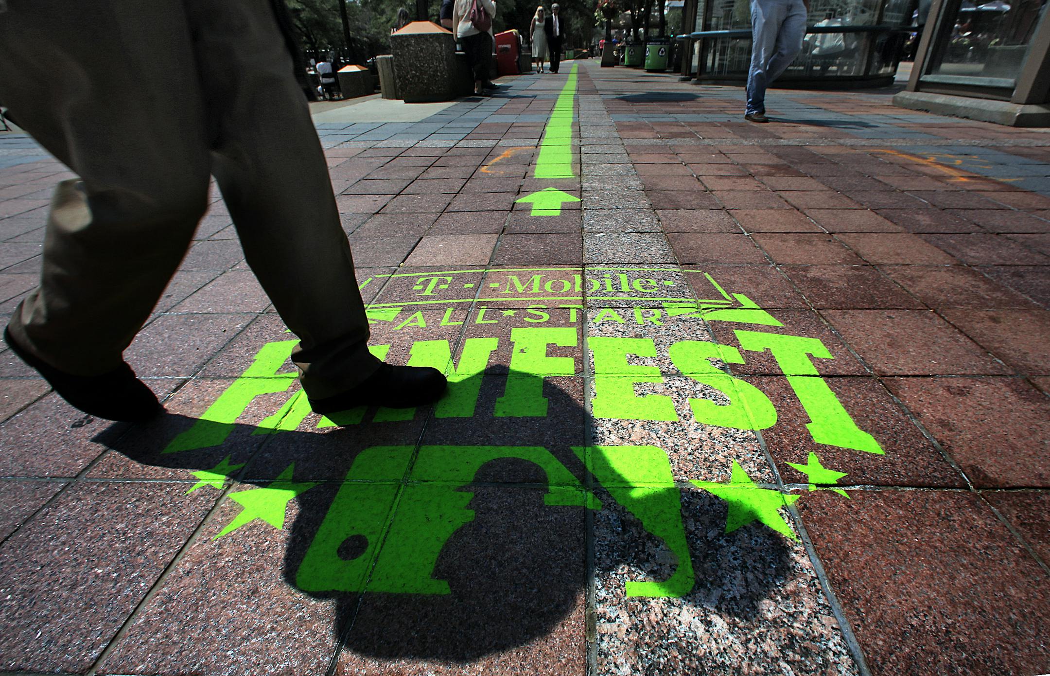 A green painted line with some informational markings runs through a portion of downtown (here along Nicollet Mall) between the Minneapolis Convention Center, site of All-Star FanFest, and Target Field.