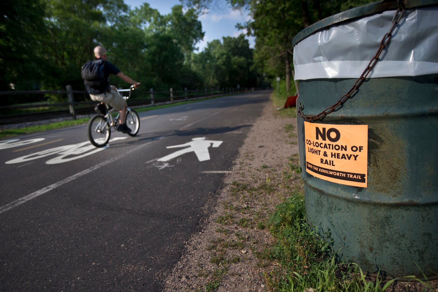 In this July 2013 file photo, the Cedar Lake Trail is pictured alongside a current freight train track that has been a proposed site for the Southwest Corridor light rail line in St. Louis Park, Minn.