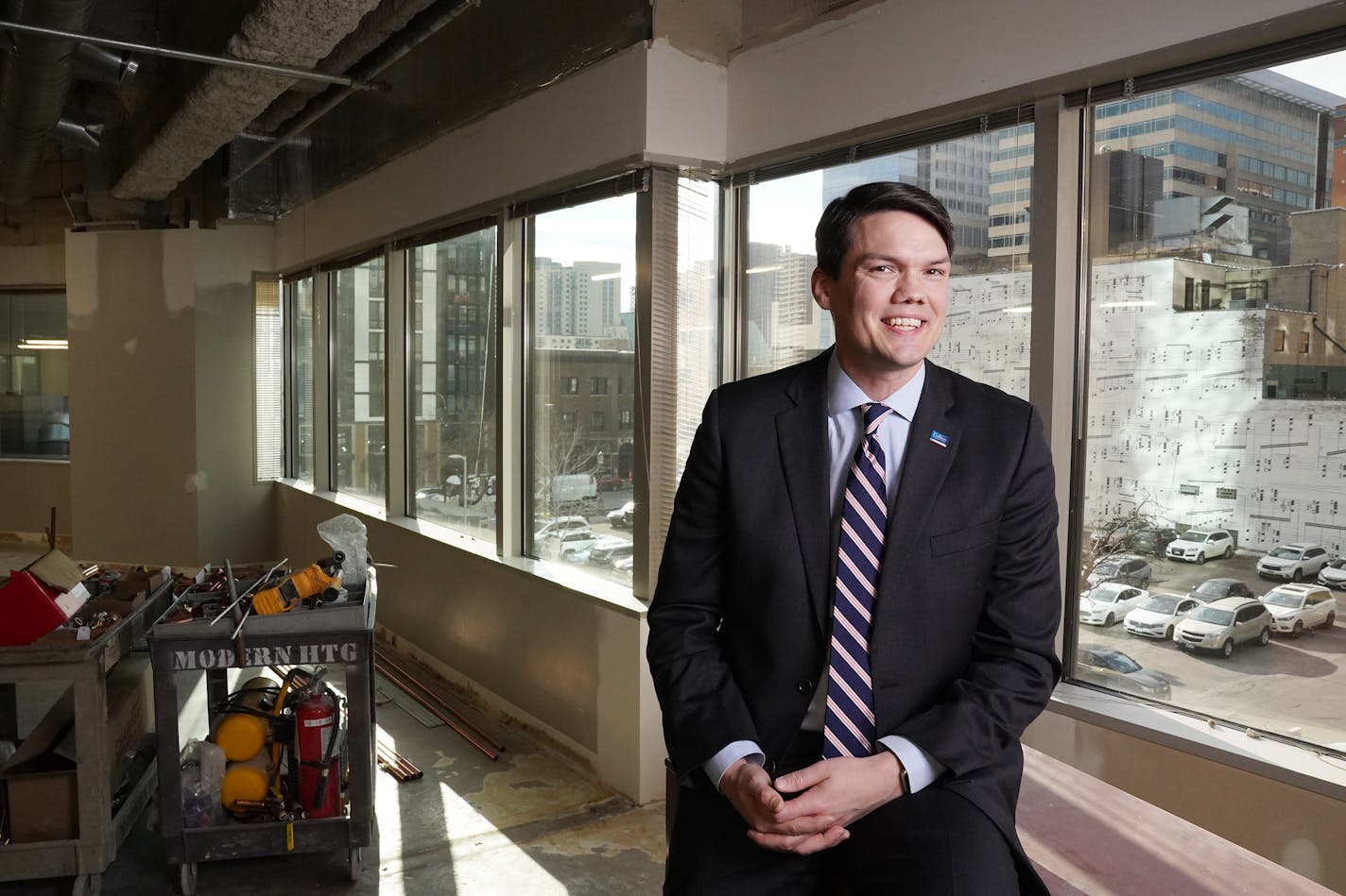 Jeremy Jacobs, managing director of brokerage for Colliers International Twin Cities, sat for a portrait in the company's downtown office, still under construction, Wednesday. ] ANTHONY SOUFFLE • anthony.souffle@startribune.com