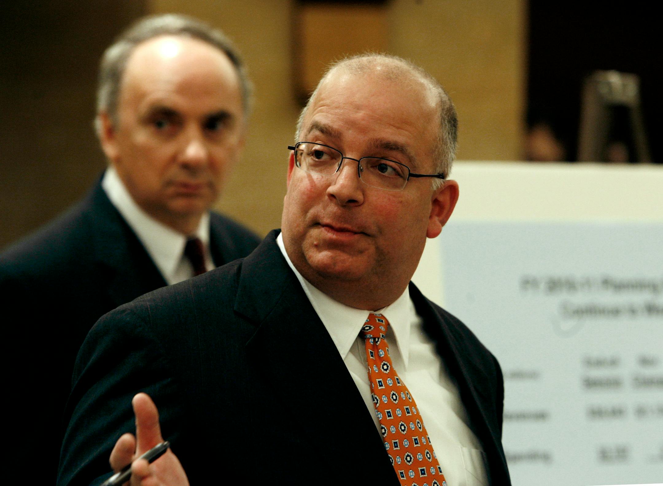 Tom Hanson, state commissioner of finance, right, and Tom Stinson, state economist, talked about the nearly $1 billion state deficit on Thursday at the Capitol. It's feared that the deficit could swell to $2 billion over the next few years.