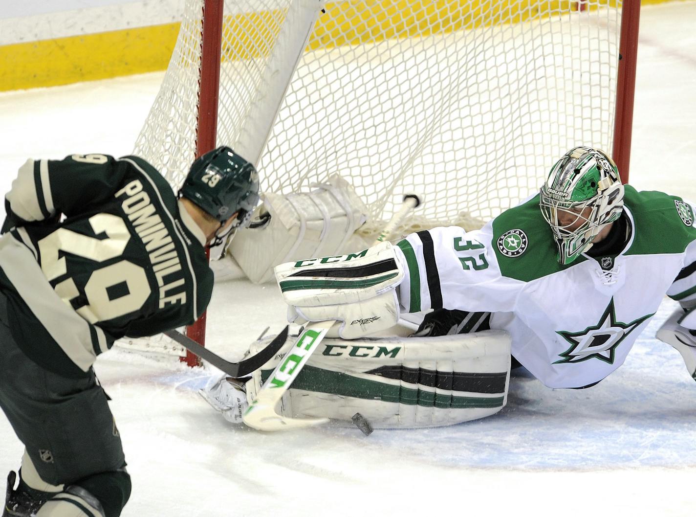 Dallas Stars' goalie Kari Lehtonen, right, of Finland, makes the pad save on Minnesota Wild's Jason Pominville (29) in the first period of an NHL hockey game, Tuesday, Feb. 9, 2016, in St. Paul, Minn. (AP Photo/Tom Olmscheid) ORG XMIT: MNTO103