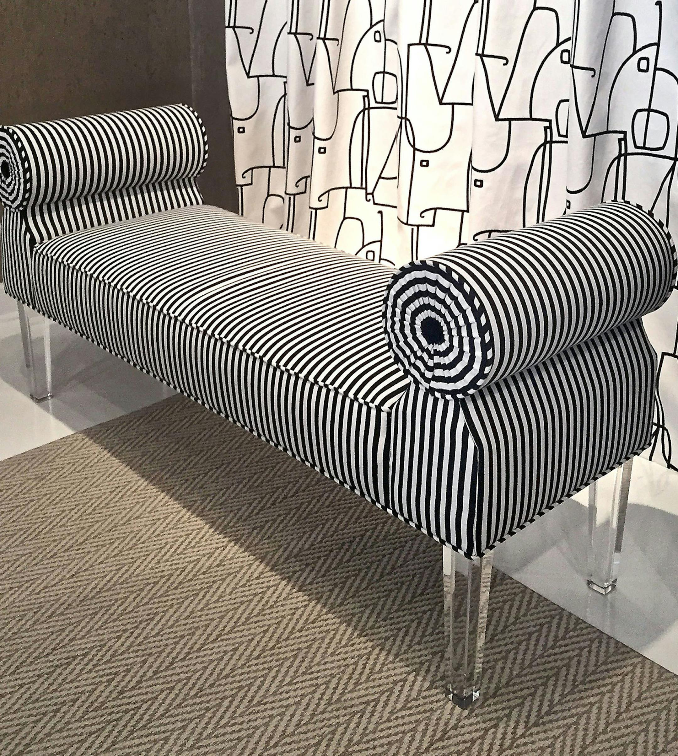 Ambella Home's tightly upholstered Ava bench uses modern acrylic legs to add zest to an 18th-century French form. (Patricia Sheridan/Pittsburgh Post-Gazette/TNS) ORG XMIT: 1187682