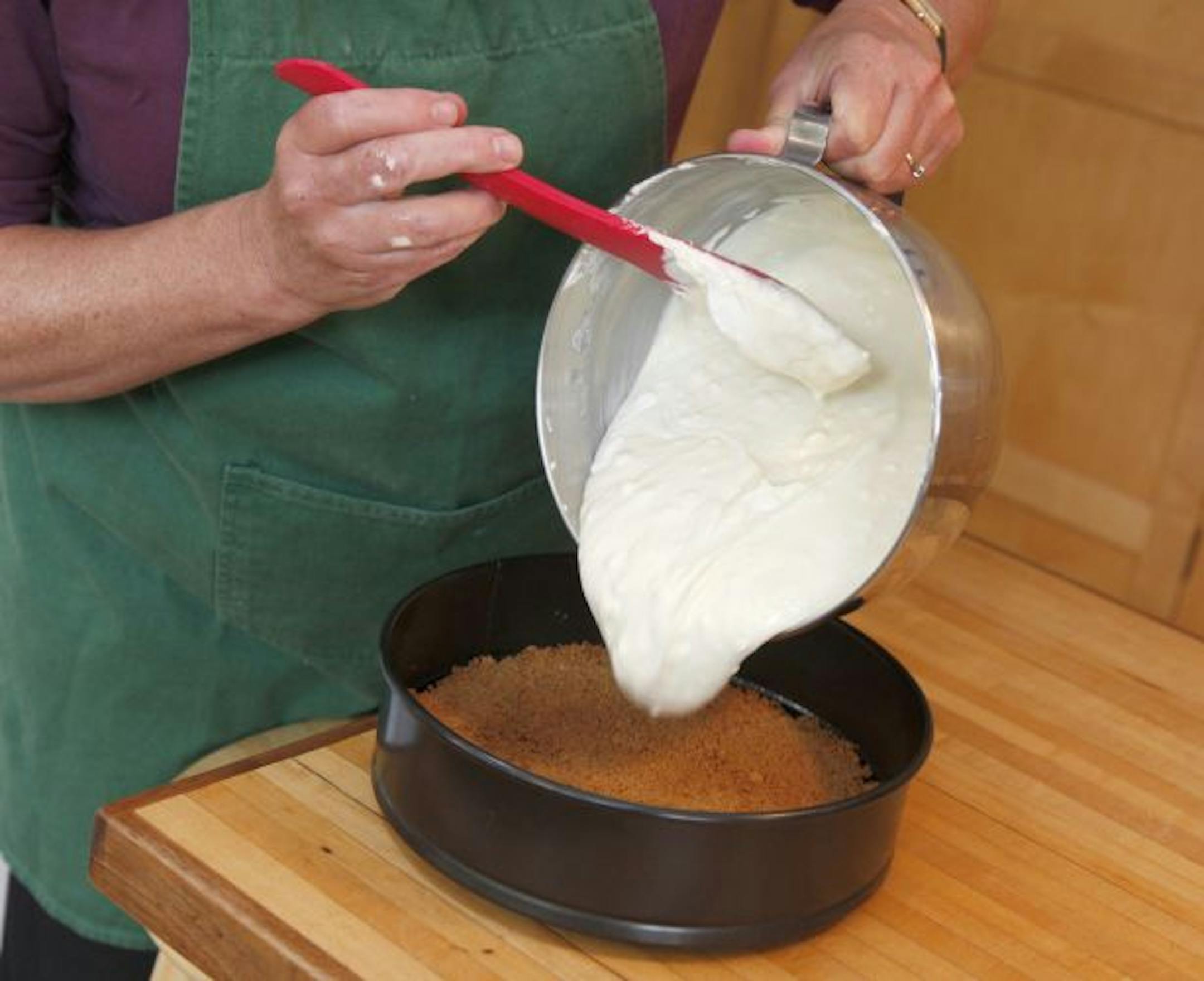 Simple to mix, the cheesecake mixture is poured onto the prebaked crust.