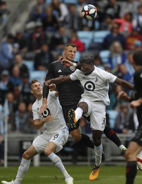 Jan Gregus (8) and Ike Opara (3) of the Loons clashed with D.C. United's Ulises Segura (8).