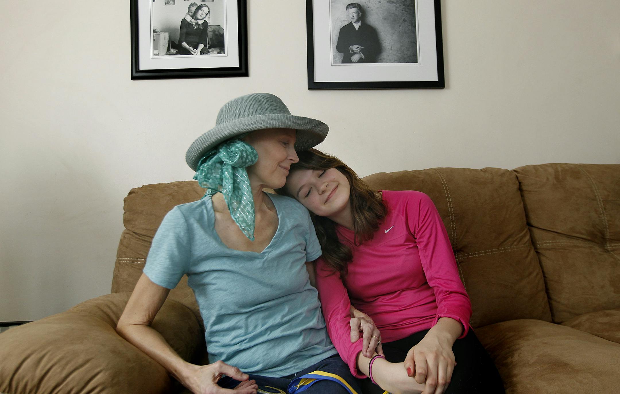 Elinor Scott got a hug from her daughter Martha Sutter, 15, at her St. Louis Park home, Tuesday, April 1, 2014. Scott ran the Boston Marathon last year and was among those unable to finish because of the bombing. She was invited back this year but is unable to run the marathon because she has late-stage pancreatic cancer. Marathon officials have granted her request to walk the last mile. ] (ELIZABETH FLORES/STAR TRIBUNE) ELIZABETH FLORES • eflores@startribune.com