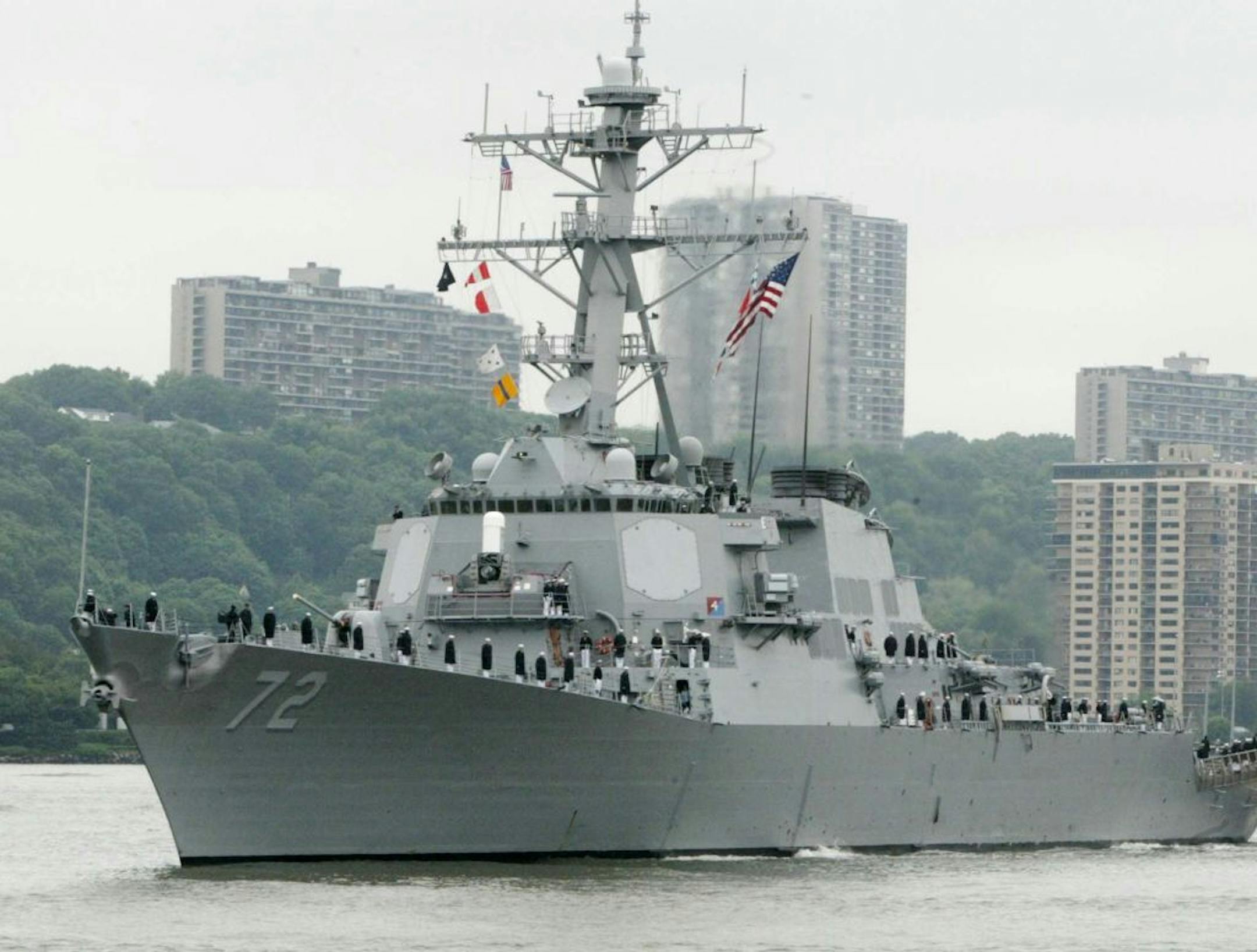 A sailor was fatally shot aboard the USS Mahan at Naval Station Norfolk late Monday, March 24, 2014. The guided-missile destroyer is shown in a 2004 file photo moving up the Hudson River in New York during Fleet Week.