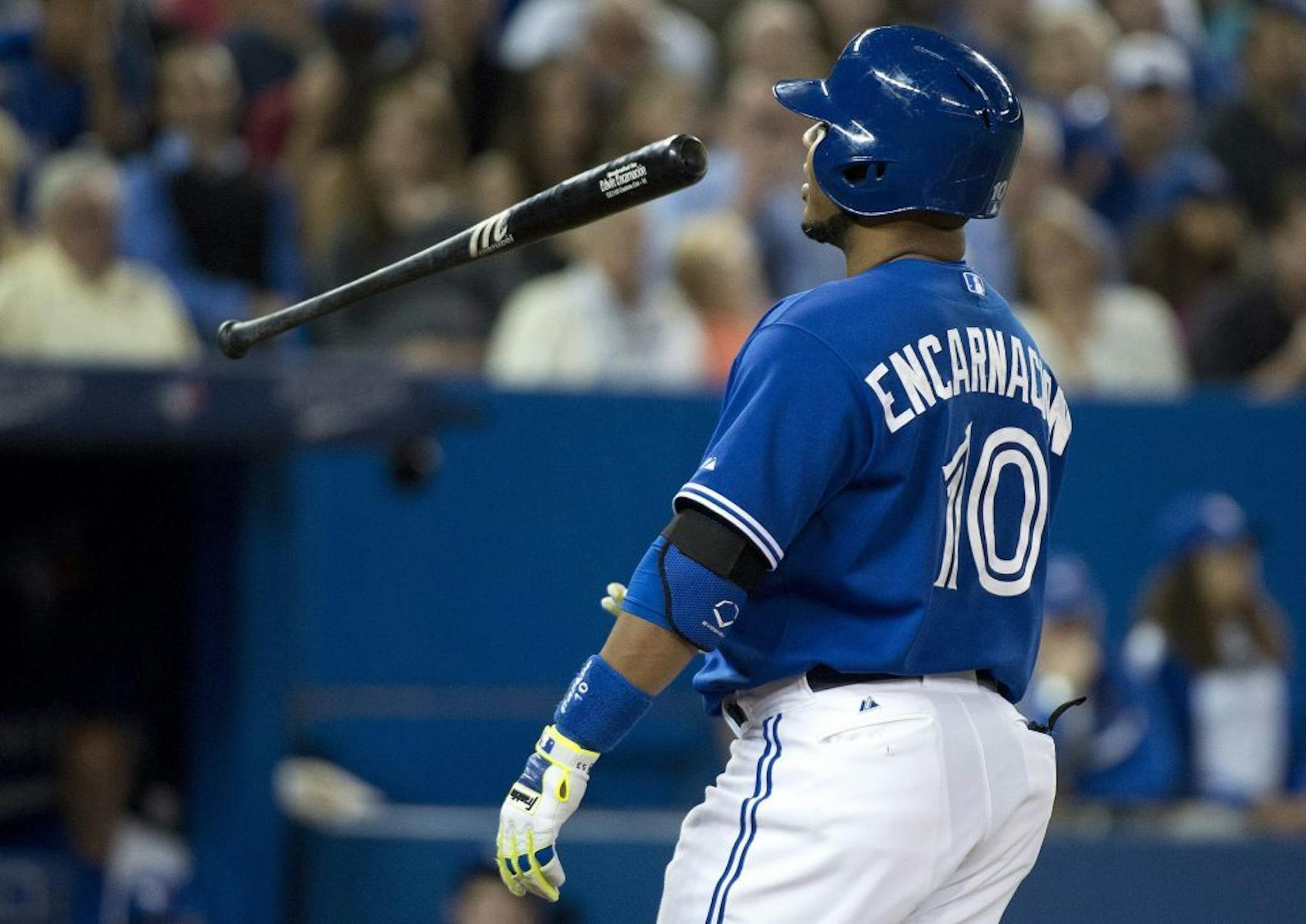Toronto Blue Jays designated hitter Edwin Encarnacion tosses his bat after striking out against the Minnesota Twins during the sixth inning of a baseball game in Toronto on Wednesday, June 11, 2014.