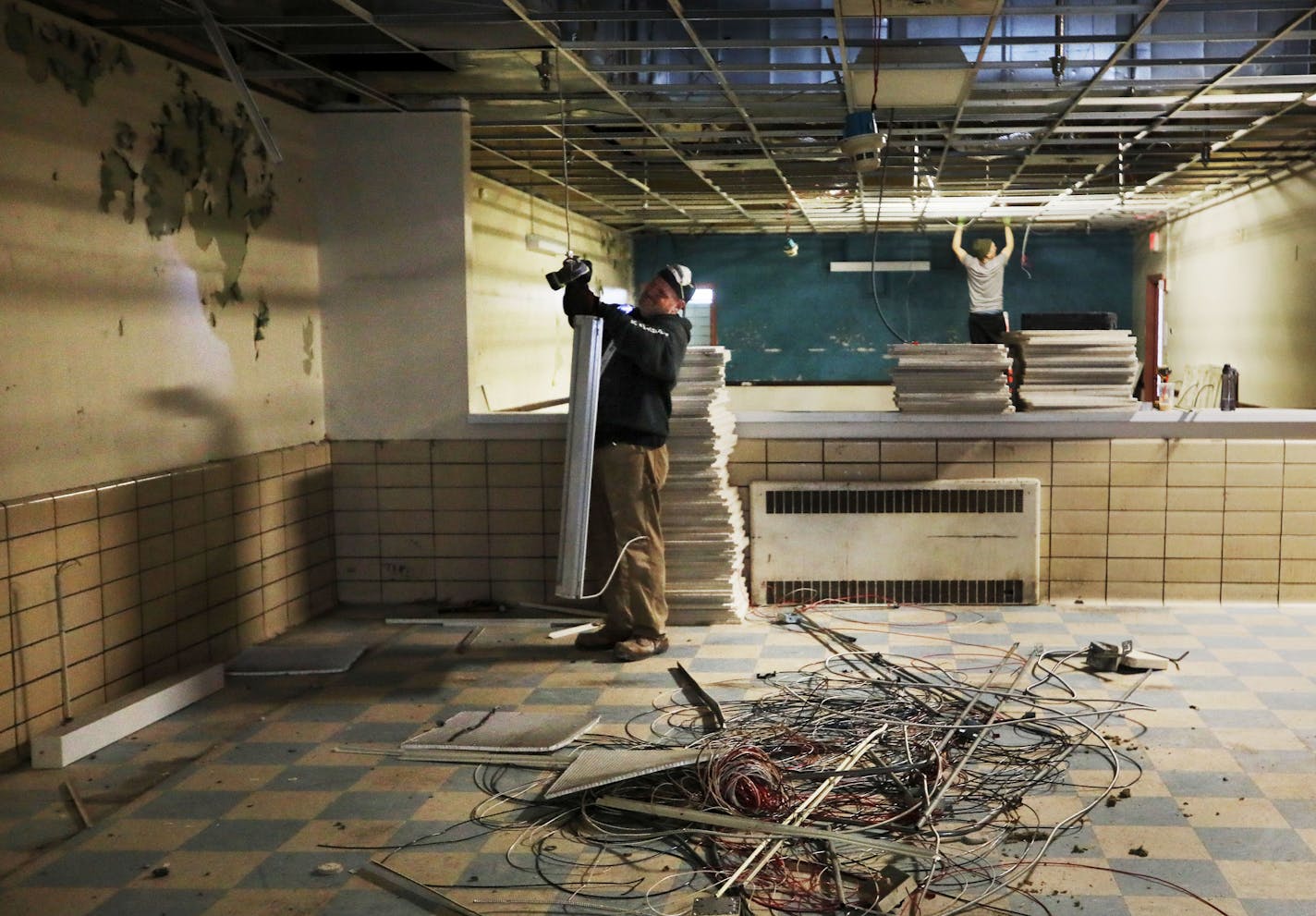 Pastor Paul Marzhan is best known as the leader of three suburban churches. But HGTV could turn him into a bigger star. Marzhan is embarking on a new role as a church flipper. Here, workers remove old light fixtures at a former Catholic Charities building, closed in 2012, that is being rehabbed into a meals program and dining hall as well as a hotel for urban missionaries Tuesday, March 12, 2019, in Minneapolis, MN.] DAVID JOLES &#x2022;david.joles@startribune.com Pastor Paul Marzhan is best kno