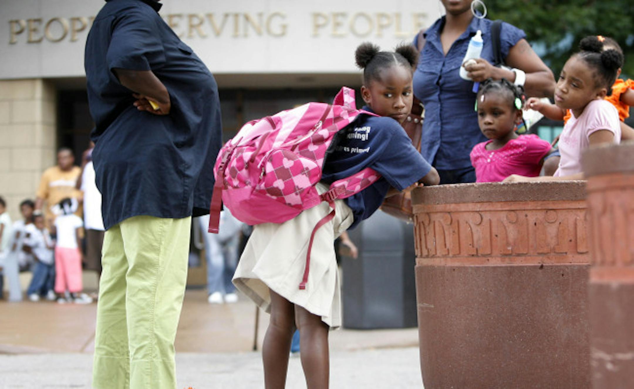 Rachel Brown, 8, waited patiently at People Serving People in Minneapolis for her bus to Sojourner Truth Academy for her first day of third grade Tuesday morning.